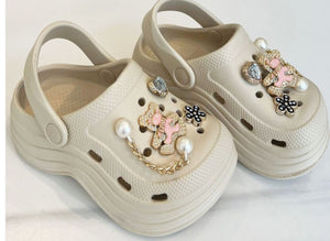 Beige crocs with charms