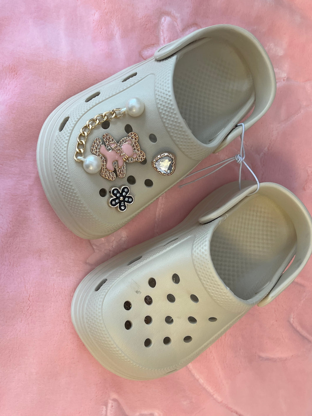 Beige crocs with charms