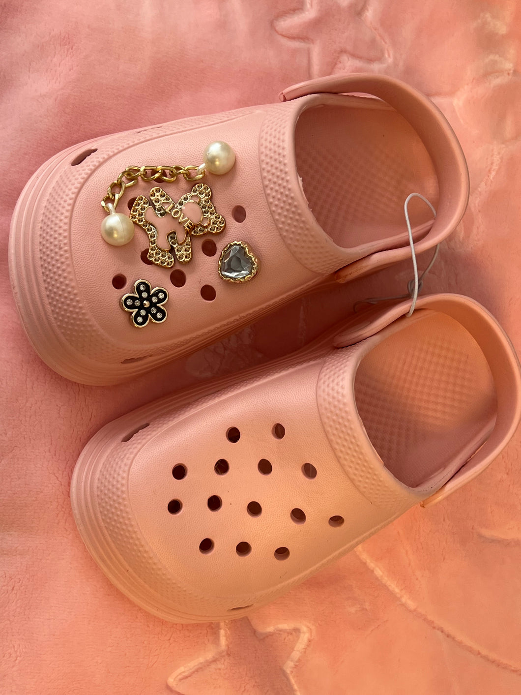 Pink crocs with charms