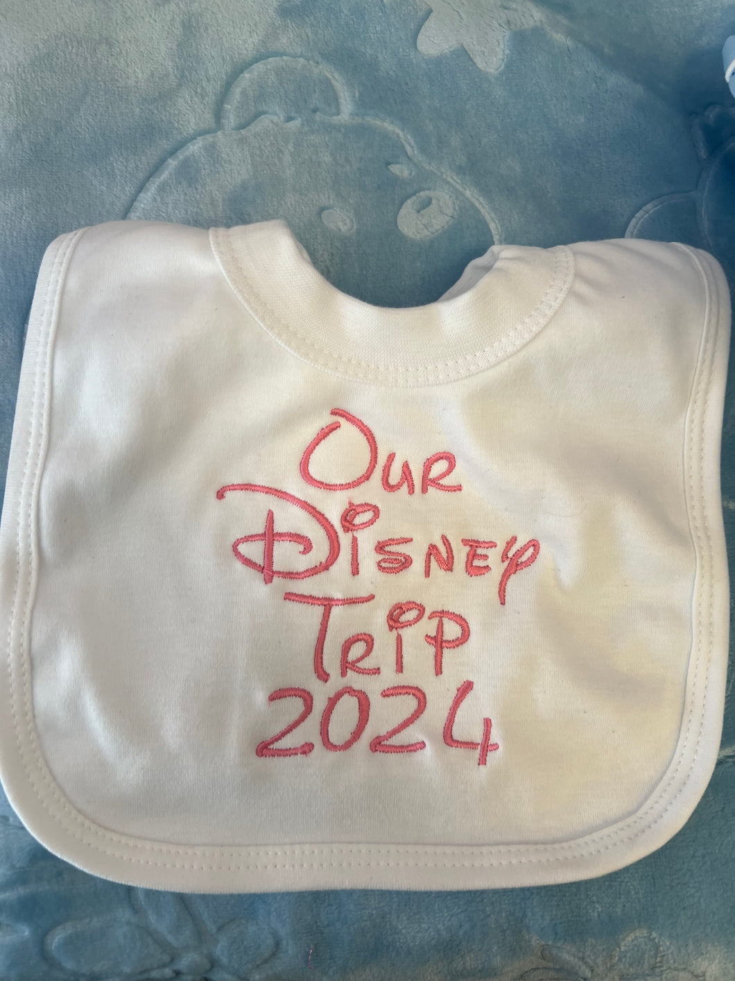 Custom made Disney trip bib any text colour